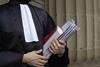 a barrister clutching books