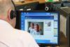 A telehealth operator answers a video phonecall from a patient