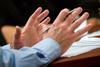 Gesticulating hands in meeting
