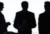Silhouette of three managers
