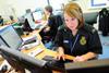 Ambulance triage: woman at desk with computer