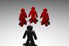 Three red figures bullying one figure