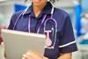 nurse close-up with tablet-926447760