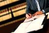Lawyer signing contracts legal