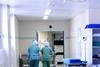 Two hospital surgeons walking down a corridor
