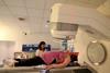 A woman having a cancer radiotherapy scan
