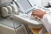 radiologist at ultrasound machine for scan