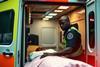 Black paramedic and ambulance, AI generated