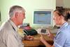 Doctor and patient discussing telehealth technology