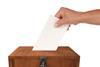 A ballot box with a vote going into it