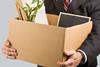 Man holding a box of office belongings