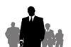 Silhouette of a smart suited man standing in a crowd