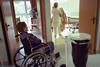 Woman in wheelchair in care home