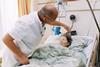 A doctor looking after a terminally ill patient
