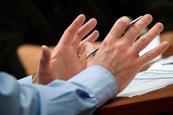 Gesticulating hands in meeting