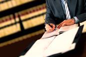 Lawyer signing contracts legal