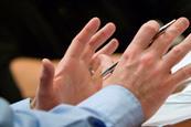 Gesticulating hands in meeting