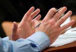 Gesticulating hands in meeting