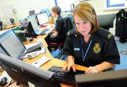 Ambulance triage: woman at desk with computer