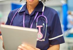 nurse close-up with tablet-926447760