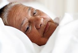 Elderly woman in bed