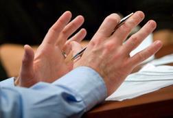 Gesticulating hands in meeting