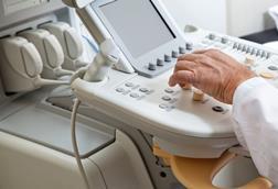 radiologist at ultrasound machine for scan