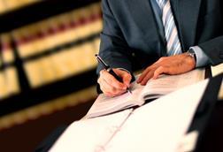 Lawyer signing contracts legal