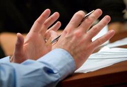 Gesticulating hands in meeting