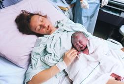 Baby and mother in maternity ward