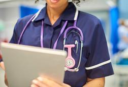 nurse close-up with tablet-926447760