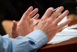 Gesticulating hands in meeting