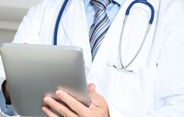 Doctor using electronic tablet device