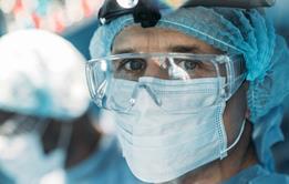 Doctor with face mask visor PPE