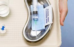 Medical tray with syringe, pills and water
