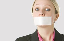 A woman with tape over her mouth