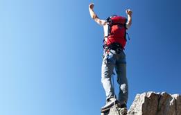 Man at top of mountain