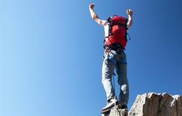 Man at top of mountain
