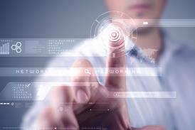 A mans hand pressing a futuristic computer screen