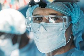 Doctor with face mask visor PPE