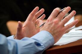 Gesticulating hands in meeting