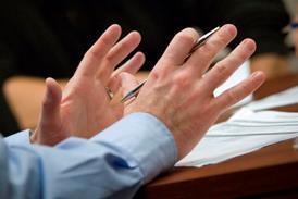 Gesticulating hands in meeting