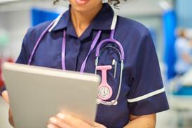 nurse close-up with tablet-926447760