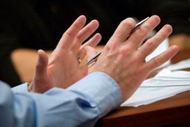 Gesticulating hands in meeting