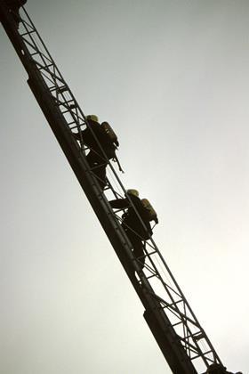Firemen climbing a ladder