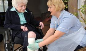 Older woman with nurse