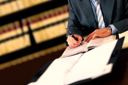 Lawyer signing contracts legal