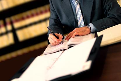 Lawyer signing contracts legal