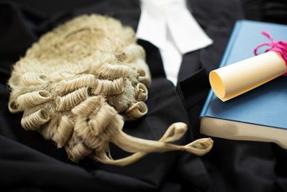 Legal still life concept with wig and briefing law