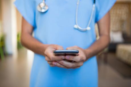 Doctor with mobile phone